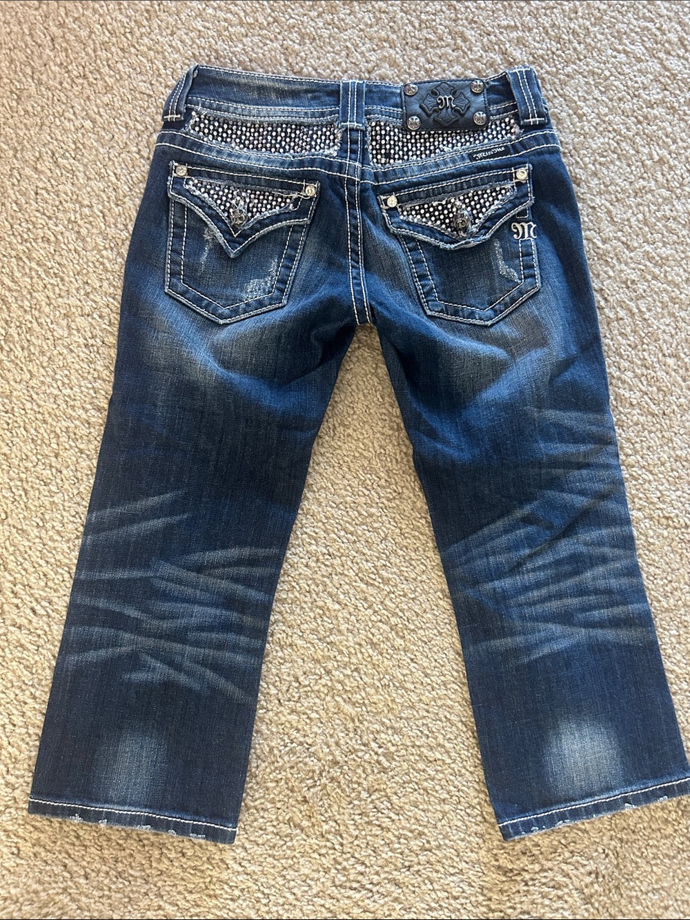 Miss Me Embellishment on back side and front pocket. Cropped Jeans. Size 26.